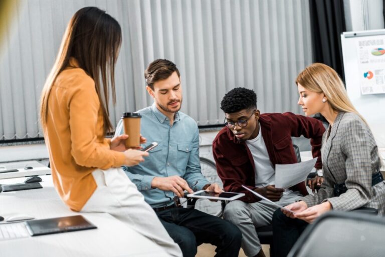 Small business team discussing website design and online marketing strategy